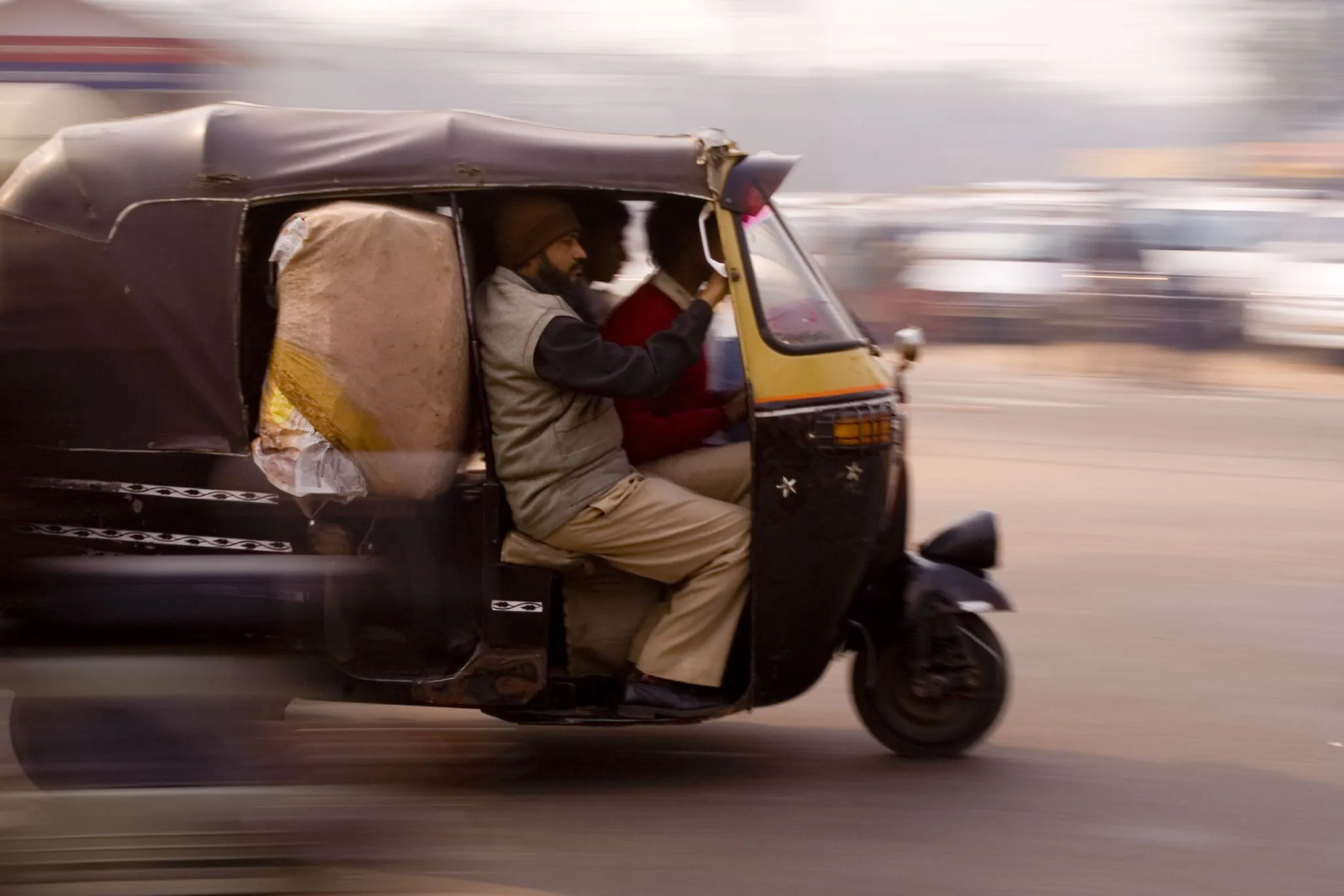 Auto-rickshaw driver on a Pune street